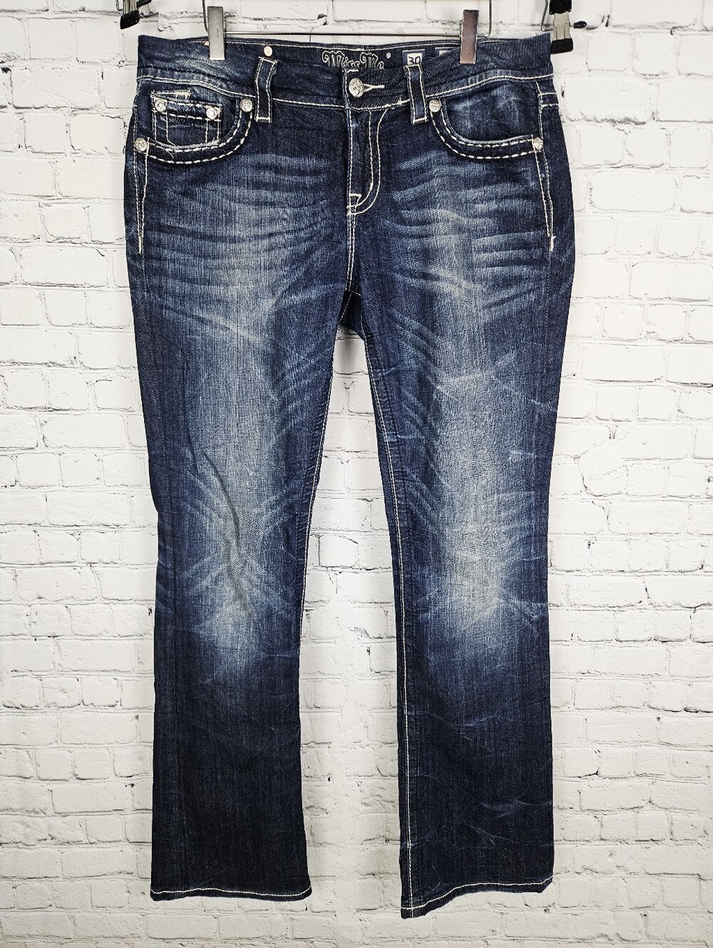 MISS ME | mid-rise easy boot cut distressed jeans